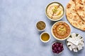 Middle eastern, arabic traditional breakfast with hummus, foul, white cheese and zaatar. Top view with copy space