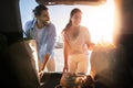 Middle eastern couple with groceries at car trunk Royalty Free Stock Photo