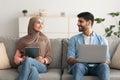 Middle Eastern Couple Using Laptop And Tablet Computers At Home Royalty Free Stock Photo