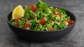 Middle Eastern cuisine. Vegetarian salad with bulgur, vegetables. Fresh bright arabic salad. Tabbouleh salad Royalty Free Stock Photo