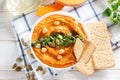 Middle Eastern food: pumpkin hummus with ingredients on the table. horizontal top view from above Royalty Free Stock Photo