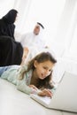 A Middle Eastern girl using a laptop Royalty Free Stock Photo