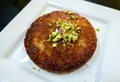 Middle Eastern Kunafeh Dessert on White Plate Royalty Free Stock Photo