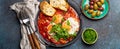 Middle Eastern and Maghrebi healthy dish Shakshouka made of eggs and tomato sauce served in pan