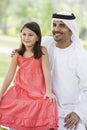 A Middle Eastern man and his daughter in a park Royalty Free Stock Photo