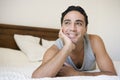A Middle Eastern man lying on a bed Royalty Free Stock Photo