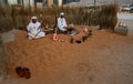 A Middle Eastern man singing and playing music | Arabic culture display - traditional cloth | Emirati Men | tourist attraction