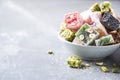 Middle Eastern sweets. Turkish delight with pistachios nuts on grey background. Copy space. Arab dessert, rahat lokum Royalty Free Stock Photo