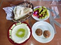 Middle eastern vegan food served with Pita, falafel and hummus. It is easy to find pure vegetarian food in the Levant and Israel o Royalty Free Stock Photo