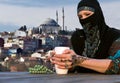 Middle Eastern Woman at Cafe Terrace