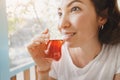 middle Eastern woman drinks traditional Turkish tea on the veranda or terrace of an outdoor restaurant Royalty Free Stock Photo