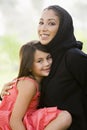 A Middle Eastern woman and her daughter