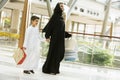 A Middle Eastern woman and her son in shopping Royalty Free Stock Photo