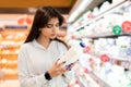 Middle Eastern Woman Holding Milk Bottle Shopping Groceries In Supermarket Royalty Free Stock Photo