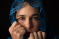 Middle Eastern woman portrait looking sad with blue hijab artist Royalty Free Stock Photo