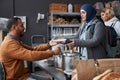 Middle Eastern Woman Receiving Meal in Refugee Help Center Royalty Free Stock Photo