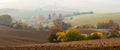 Middle-European Autumn Morning Landscape With Many Interesting Details:Mill In The Haze,Herd Of Grazing Deer, Plowed Brown Fields Royalty Free Stock Photo