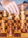 Middle game - the hand with knight makes a move on chess Board Royalty Free Stock Photo