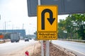 A yellow turn around sign