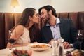 The middle is where it gets delicious. a young couple sharing spaghetti during a romantic dinner at a restaurant. Royalty Free Stock Photo