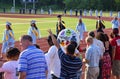 Boy Greeting Seniors at High School Graduation