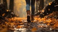 Midfoot lower section of woman walking through autumn leaves in forest. Concept of active lifestyle Royalty Free Stock Photo