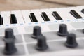 Close up of MIDI controller volume fader, knob and keys Royalty Free Stock Photo