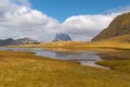 Midi d`ossau peak reflected in the water of the Anayet lakes in the Pyrenees