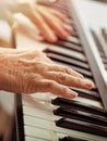 Midi keyboard or electronic piano and playing child hands. Royalty Free Stock Photo