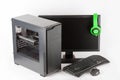 Midi tower computer case with led monitor on white background. Royalty Free Stock Photo