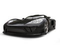 Midnight black modern super sports car - headlights closeup shot Royalty Free Stock Photo