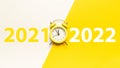 Midnight new years 2022. Retro style yellow clock in happy Christmas midnight. Countdown to new year on happy xmas Royalty Free Stock Photo