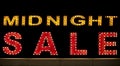 Midnight sale background. Brightly colored vintage advertising sign board with illumination
