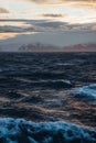 The Midnight sun over the icebergs of the Drake Passage near the Antarctic Peninsula in Antarctica. Royalty Free Stock Photo