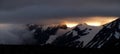 Midnight sun over the snowy mountains Royalty Free Stock Photo