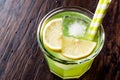 Midori Sour Cocktail with ice and lemon. Royalty Free Stock Photo