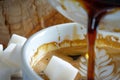 midpour closeup coffee with sugar cubes ready on the side Royalty Free Stock Photo