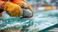 Midrange view of a specialist treating long cracks on a glass surface focusing on sealing techniques that reinforce Royalty Free Stock Photo