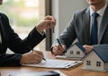 Real Estate Agent Handing Over House Key After Signing Contract for Property Sale Royalty Free Stock Photo