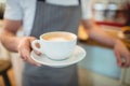 Midsection of barista serving coffee at shop Royalty Free Stock Photo