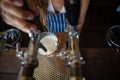 Midsection of barmaid pouring beer from tap in glass Royalty Free Stock Photo