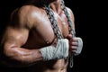 Midsection of bodybuilder holding chain Royalty Free Stock Photo