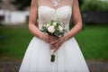 Midsection Of Bride Holding Bouquet Royalty Free Stock Photo