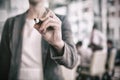 Midsection of businessman holding marker