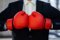 Midsection Of Businessman Wearing Boxing Gloves Royalty Free Stock Photo