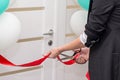 Midsection of businesspeople cutting the ribbon. Royalty Free Stock Photo