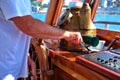 Captain holding hands on ship rudder Royalty Free Stock Photo