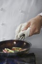 Midsection Of Chef Cooking Food Royalty Free Stock Photo