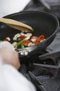 Midsection Of Chef Cooking Food Royalty Free Stock Photo