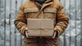 Midsection of a delivery person holding a package. AI Generated. Royalty Free Stock Photo